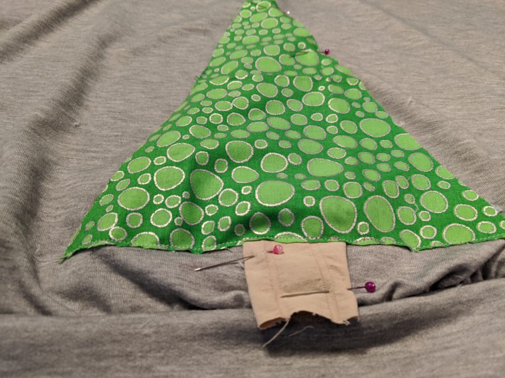 Pinning Christmas tree to sweater